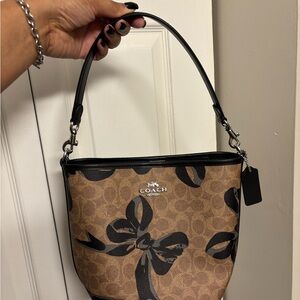 Coach Brown Signature Canvas Shoulder Bag with Black Bow Accents